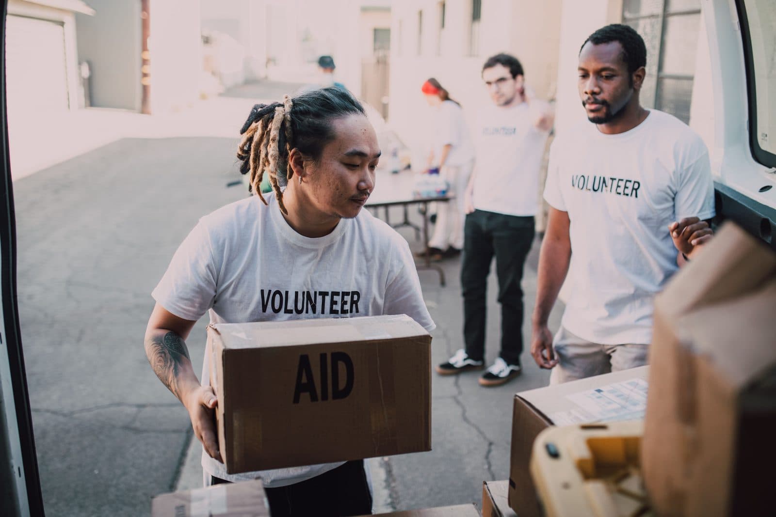 Volunteers loading boxes of aid supplies