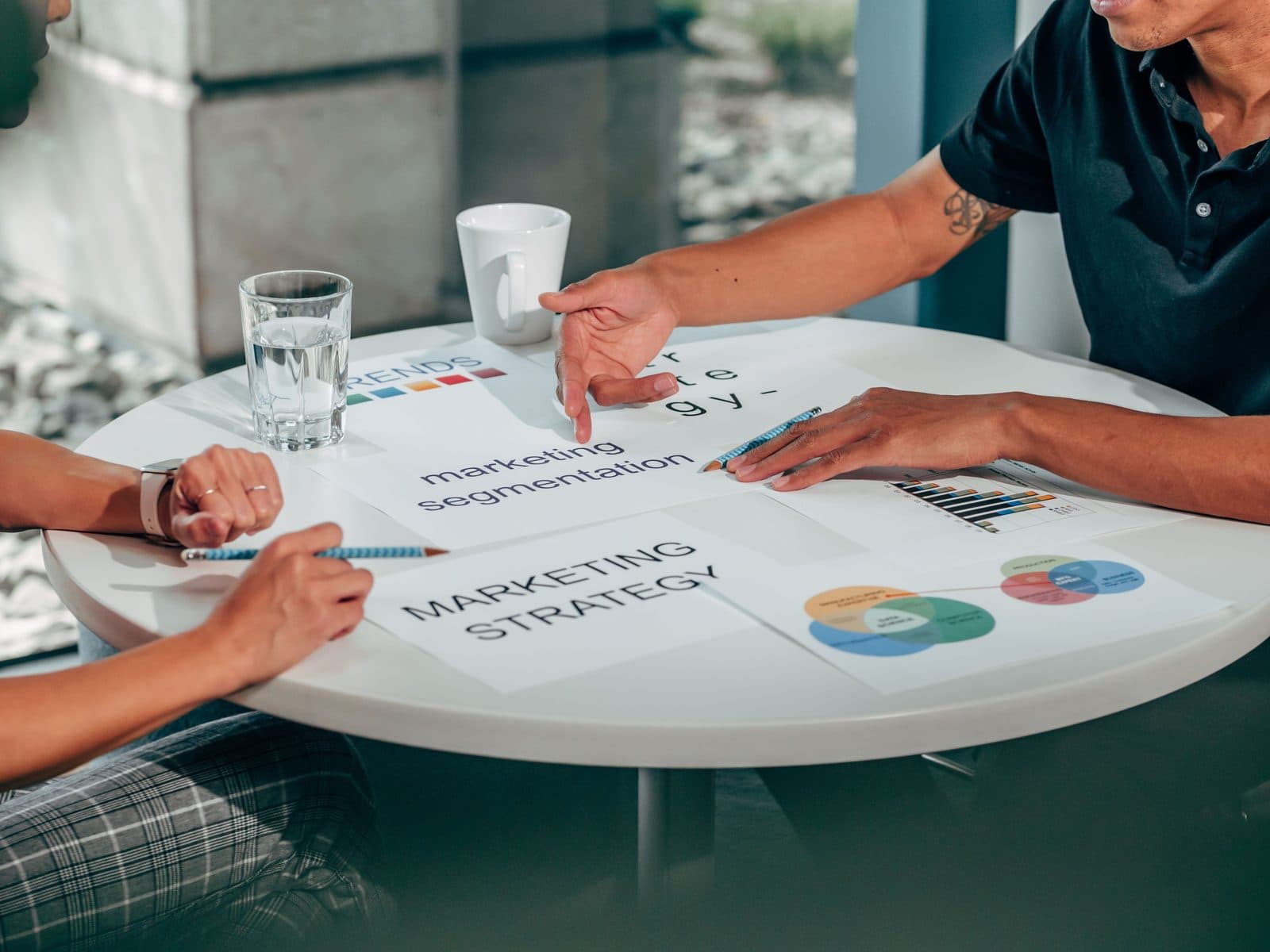 Marketing strategy documents laid out on a table